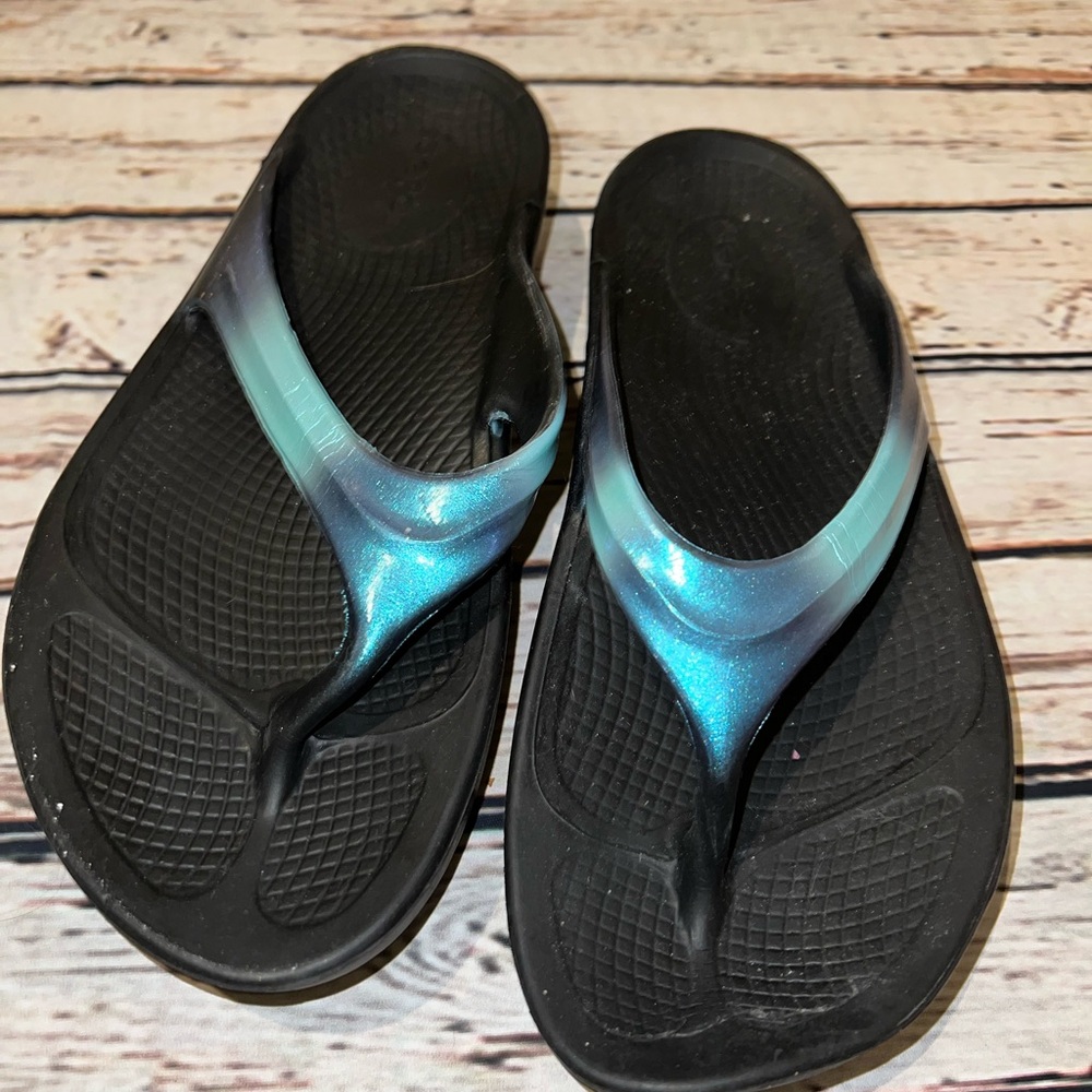 Size 8 metallic blue oofos barely worn at all.